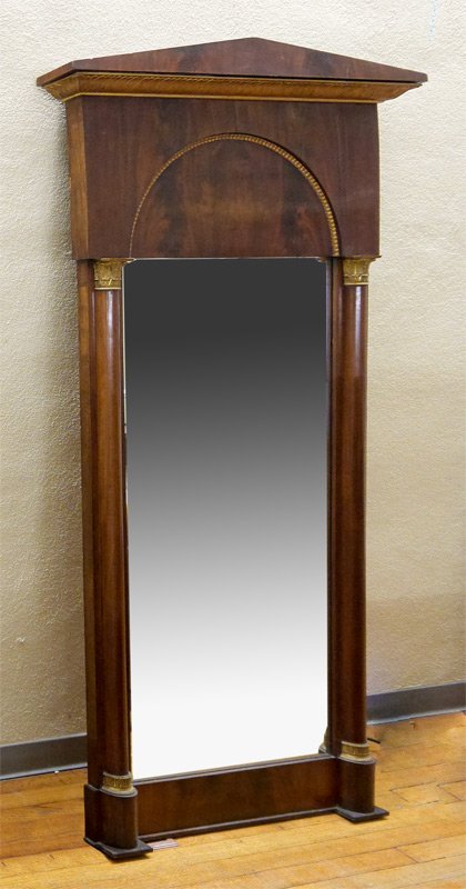 VICTORIAN MAHOGANY PIER MIRROR: VICTORIAN MAHOGANY PIER MIRROR: Triangular pediment over acanthus leaf carved gilt wood trim, half column stiles with gilt metal decoration and collars. Overall measures 77" h. x 38 3/4" x 3 1/2".