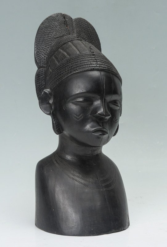 CARVED AFRICAN EBONY WOOD BUST: CARVED AFRICAN EBONY WOOD BUST: Carved figure of a female bust, unsigned. 15 3/4" h. x 6 1/2" x. 7".