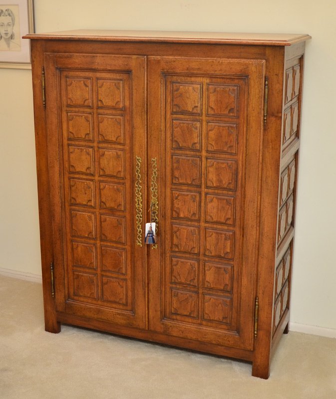 DON RUSEAU CARVED WALNUT GENTLEMENS CHEST: DON RUSEAU CARVED WALNUT GENTLEMENS CHEST: 2 door tall chest by Don Ruseau NYC, with carved panels on front and sides, brass escutcheon and hardware. 6 internal drawers, overall measures 59" x 49 1/4"