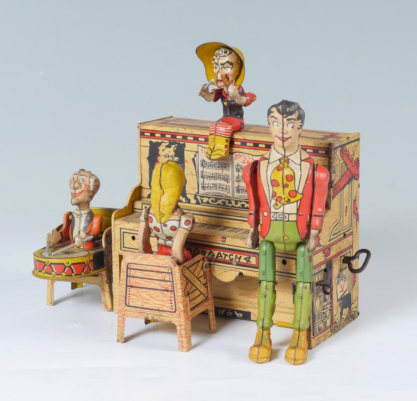 LI'L ABNER & HIS DOGPATCH BAND WIND UP TOY: LI'L ABNER & HIS DOGPATCH BAND WIND UP TOY: Tin lithograph toy circa 1945 by Unique Art Manufacturing Co. Inc., 4 piece wind up band featuring Li'l Abner, Daisy Mae Yokum, Mammy Yokum and Pappy Yokum.