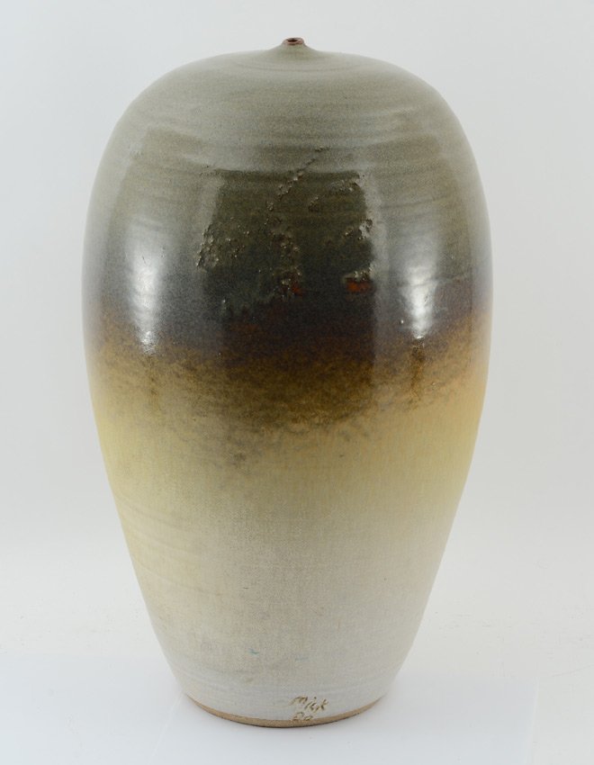MICHAEL MICK ART POTTERY VESSEL / VASE: MICK, Michael, (American, 20th Century): Large vessel with graduating glaze, tiny opening at top, signed Mick, '80 at base. Overall 20 3/4" h. x 12".