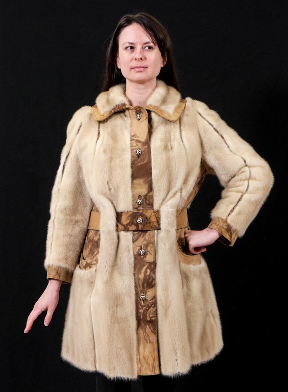 VINTAGE MINK COAT WITH LEATHER TRIM: VINTAGE MINK COAT WITH LEATHER TRIM: Knee length blonde mink coat with mottled brown leather trim, note the groovy circle cut out pockets and graphic lining. May be worn with or without the buckle bel