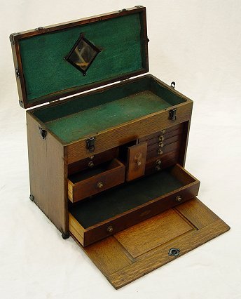 GERSTNER OAK MACHINEST CHEST TOOL BOX: OAK MACHINIST CHEST: Multi drawer carrying case, the front panel encloses the drawers. Bears a label with only ''Dayton Ohio'' readable. Approx. 16''h, 20'' x 9 1/2''. A kind person has e-mailed us th