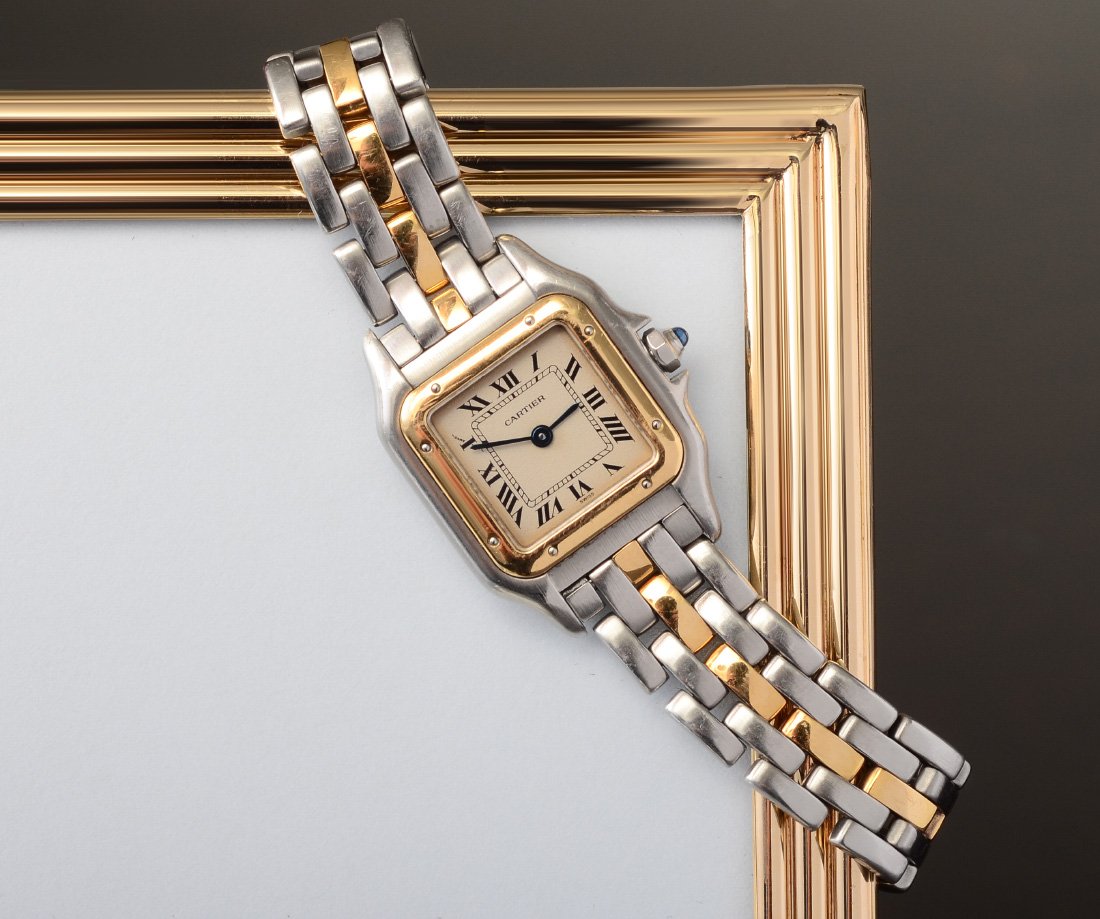LADIES CARTIER PANTHERE WATCH: LADIES CARTIER PANTHERE WRISTWATCH: A Cartier classic stainless steele and 18 yellow gold watch. Ivory color dial with black Roman numerals. Case is 22 mm. Swiss quartz movement, new battery, in worki