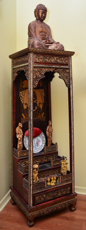 BUDDHIST TEMPLE WITH SEATED BUDDHA: BUDDHIST TEMPLE WITH SEATED BUDDHA: Thailand Buddhist altar / temple, with carved, pierced and gilt floral panels and decoration. Applied mirrored trim, base with 3 stepped levels over single drawer. 