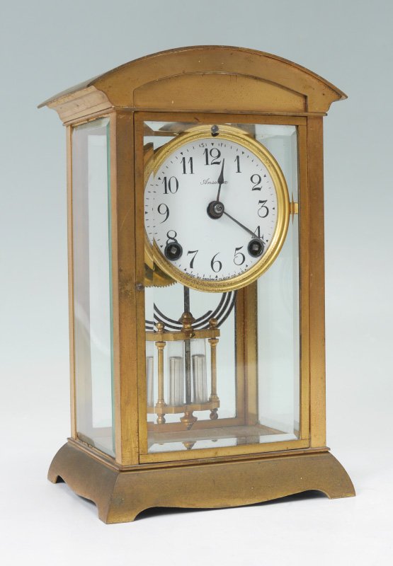 ANSONIA CRYSTAL REGULATOR MANTLE CLOCK: ANSONIA CRYSTAL REGULATOR MANTLE CLOCK: Domed brass top, beveled glass sides, splayed base. Porcelain dial marked Ansonia, Arabic numerals. Time and gong strike movement, faux mercury pendulum. Measur