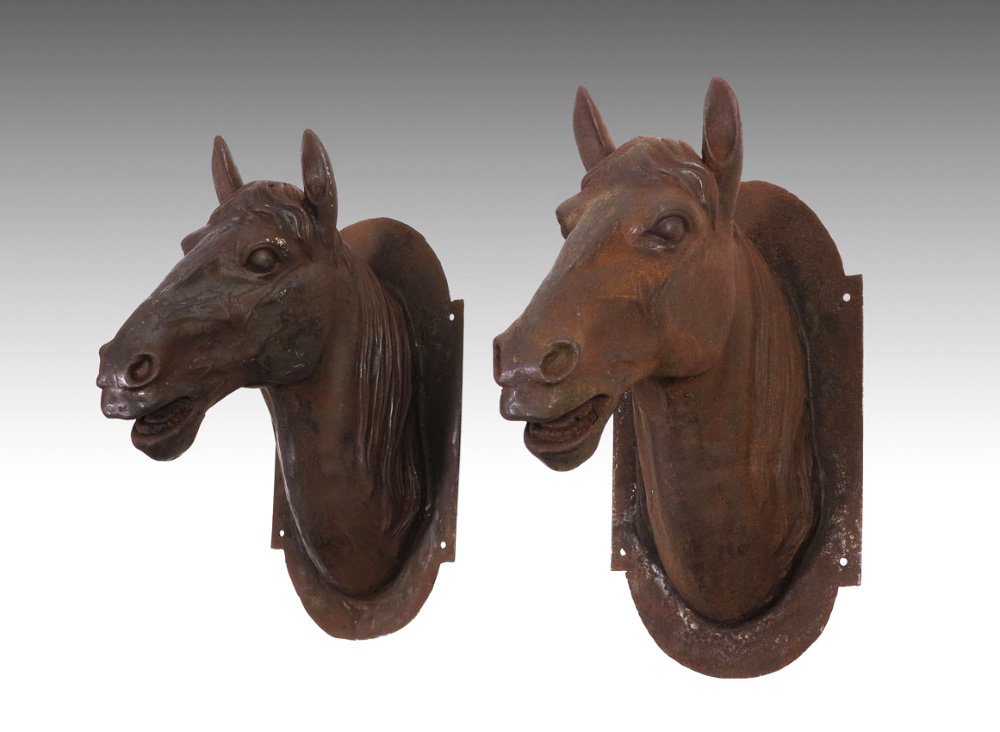 PAIR LIFE SIZE CAST IRON WALL MOUNT HORSE HEADS: PAIR LIFE SIZE CAST IRON WALL MOUNT HORSE HEADS: Unmarked, 26" h. x 14 1/4" x 22 1/2" deep