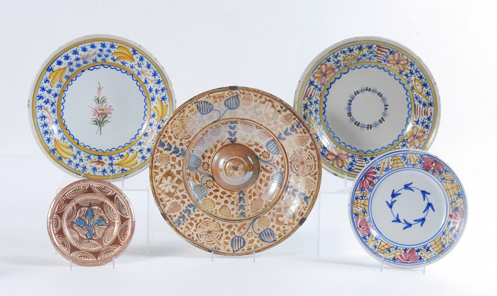 5 CONTINENTAL FAIENCE POTTERY CHARGERS: 5 CONTINENTAL FAIENCE POTTERY CHARGERS: Collection of 5 decorative chargers, most likely Spanish, each decorated with floral motifs and mounted with wall hanging hardware. Largest with raised center 2