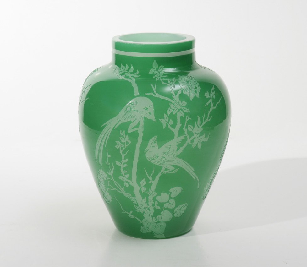 STEUBEN ACID CUT BACK JADE GLASS VASE: STEUBEN ACID CUT BACK JADE GLASS VASE: Acid cut to alabaster with birds in branches motif, shape 6148, orginal Steuben paper label on base. 9 1/2'' h. x 6 3/4''.