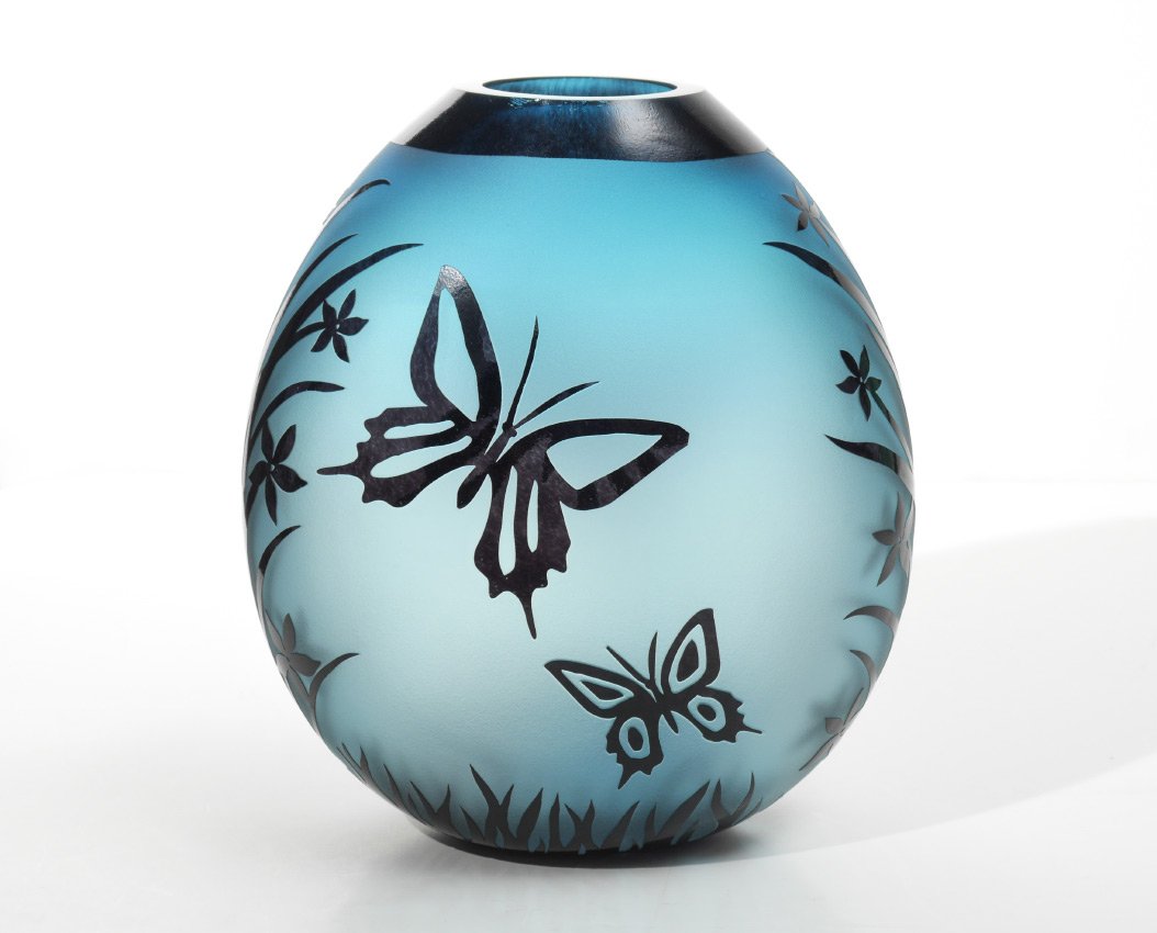 DUNCAN MCCLELLAN BUTTERFLY VASE: DUNCAN MCCLELLAN BUTTERFLY VASE: Blue frosted glass ground with carved butterflies and flowers motif. Signed on base, 10 1/2'' h. x 9''.
