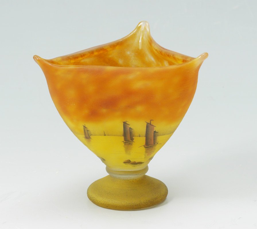 DAUM NANCY TRIANGULAR FOOTED VASE: DAUM NANCY TRIANGULAR FOOTED VASE: Triangular shaped top with flares at corners, etched and enamel decorated in the "Voiliers, Coucher de Soleil" or "Sailboats at Sunset" pattern, signed on base Daum 