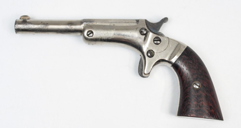 J. STEVENS ARMS ANTIQUE OLD MODEL POCKET PISTOL: J. STEVENS ARMS ANTIQUE OLD MODEL POCKET PISTOL: Antique pistol with 3 1/2'' part octagon, part round approx 22 cal. barrel marked J. Stevens A & T Co. Chicopee Falls Mass Pat. Sept. 6 1864. Wood grip
