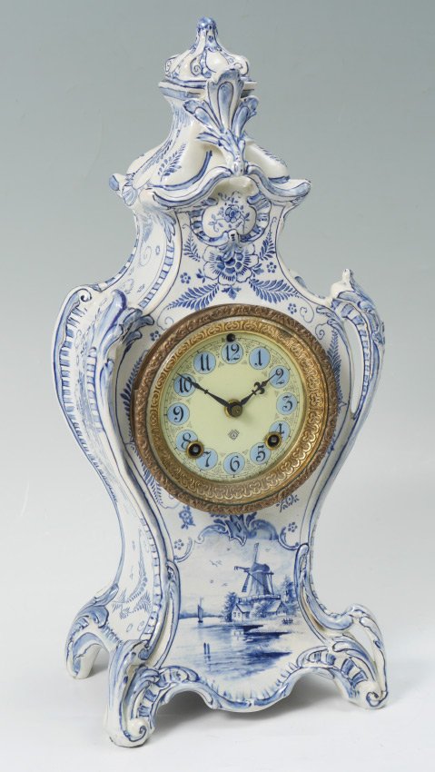 ANSONIA ROYAL BONN DELFT PORCELAIN CLOCK: ANSONIA ROYAL BONN DELFT PORCELAIN CLOCK: Blue and white decorated porcelain case by Royal Bonn with windmill landscape and floral motif, impressed with partial Bonn mark, HO, 1249. Porcelain dial wit