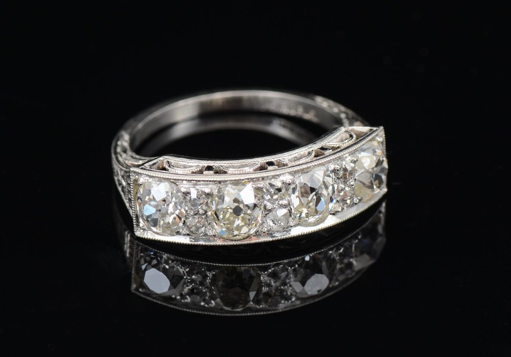 EDWARDIAN PLATINUM 1.40 CTW DIAMOND RING SZ 4: PLATINUM EDWARDIAN WEDDING BAND / RING: The 4 Old Mine cut and 6 early single cut diamonds are set in a beautifully hand chased open gallery ring. Diamond weight is approx. 1.50 Ct. Rating is VS2-SI1 