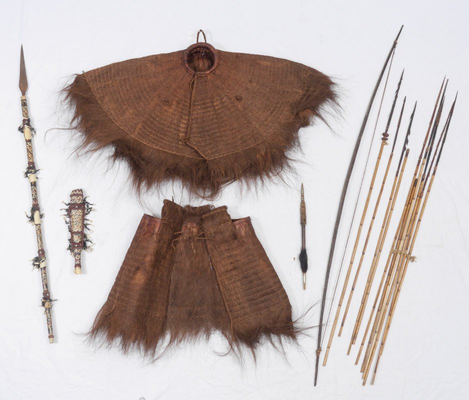 POLYNESIAN COCONUT FIBER RAIN SUIT & SPEARS: POLYNESIAN COCONUT FIBER RAIN SUIT & SPEARS: Collection of items to include a 2 part Southeast Asian rain suit made of coconut husk. Lot also includes bow, collection of bamboo and metal arrows, paint