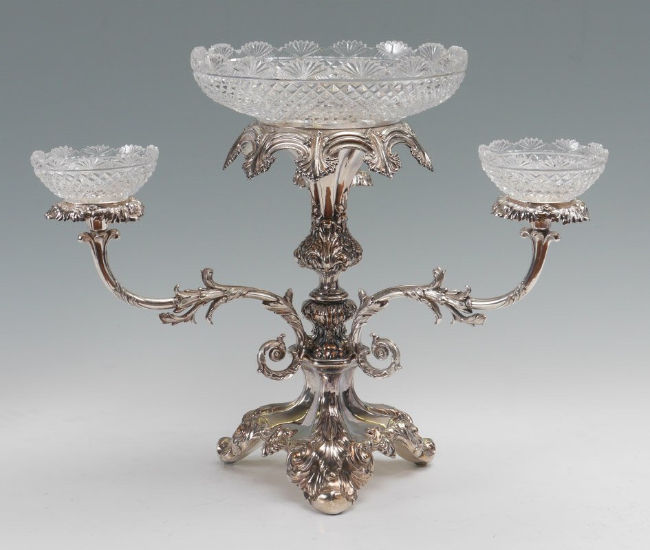 VICTORIAN SILVER PLATE CUT GLASS EPERGNE: VICTORIAN SILVER PLATE CUT GLASS EPERGNE: 3 arm silver plate floral motif body with floriform bobeches, 15 1/4" h . x 20". 4 matching cut glass bowls, center bowl 4 1/8" h. x 11 1/2", side bowls 2 1/2