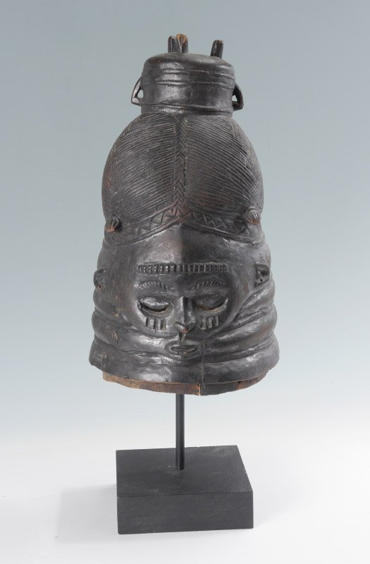 CARVED AFRICAN MENDE TRIBE HELMET MASK: CARVED AFRICAN MENDE TRIBE HELMET MASK: Carved wood with figural face, Mende tribe for the Sande Society, Sierra Leone. Overall measures 15" h. x 7 1/2" x 9".