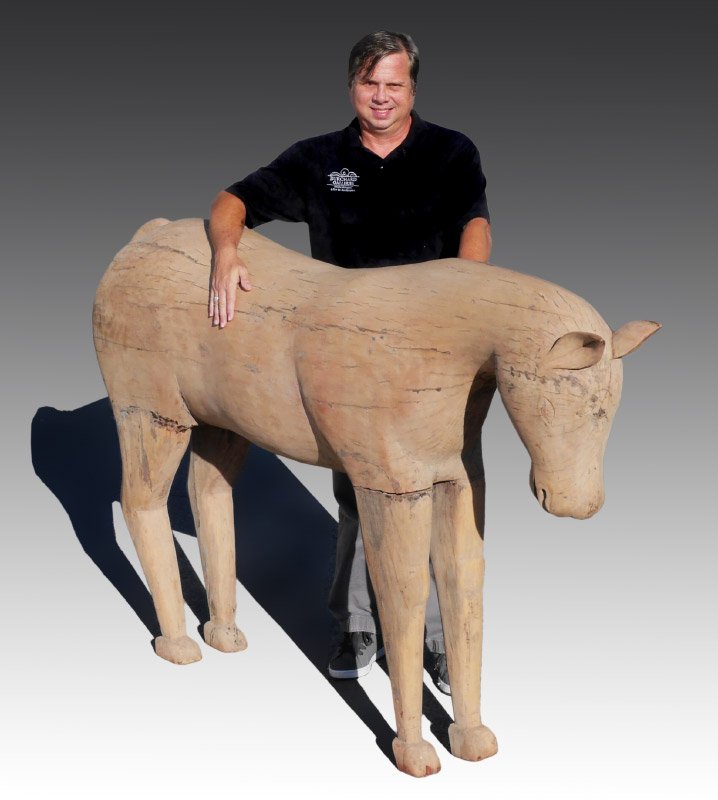 NEARLY LIFE SIZE INDONESIAN CARVED HORSE: NEARLY LIFE SIZE INDONESIAN CARVED HORSE: Model of a standing horse, bare wood with no finish, overall measures 49 1/2" x 83" x 19".
