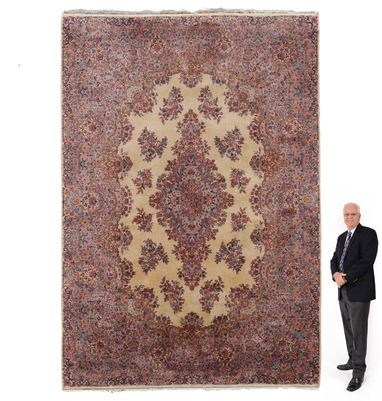 AMERICAN KARASTAN MACHINE MADE WOOL RUG 8'7"x12'2": APPROX. 40-60 YR. OLD AMERICAN KARASTAN MACHINE MADE WOOL RUG, 8'7" x 12'2": This Karastan has a traditional Persian Kerman design and coloring. The ivory center field has a large diamond shaped medal