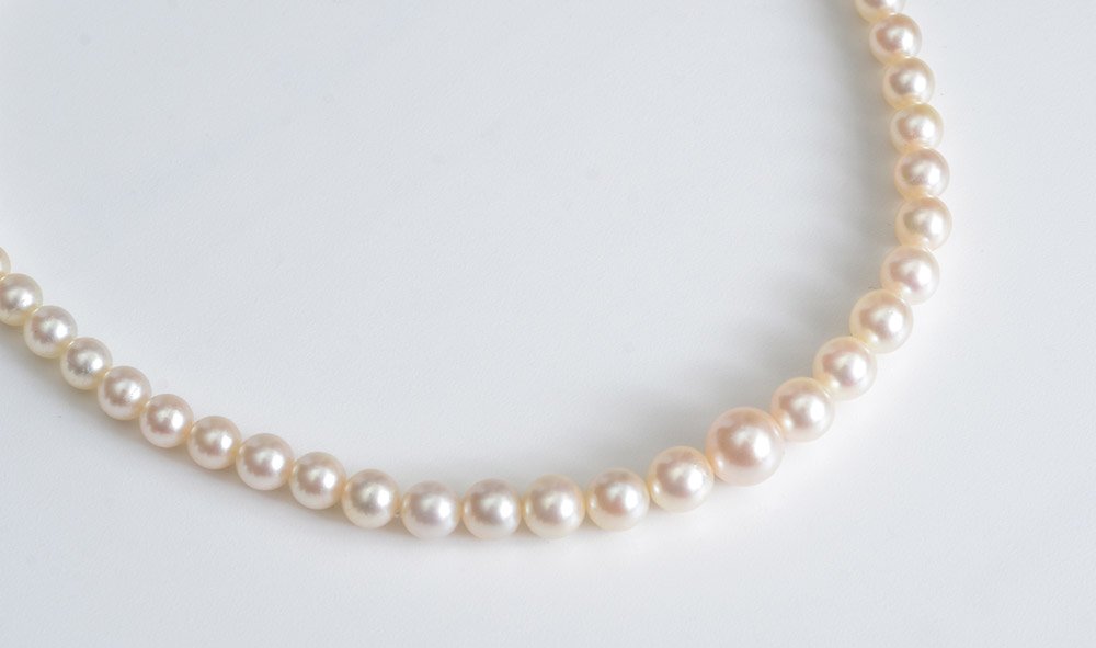 MIKIMOTO 18" PEARL NECKLACE: MIKIMOTO PEARL NECKLACE: 18" princess length strand of 3.50 - 7.00 mm graduated Akoya pearls. Mikimoto grade A. Sterling silver clasp is signed Mikimoto. Original box and leaflet.