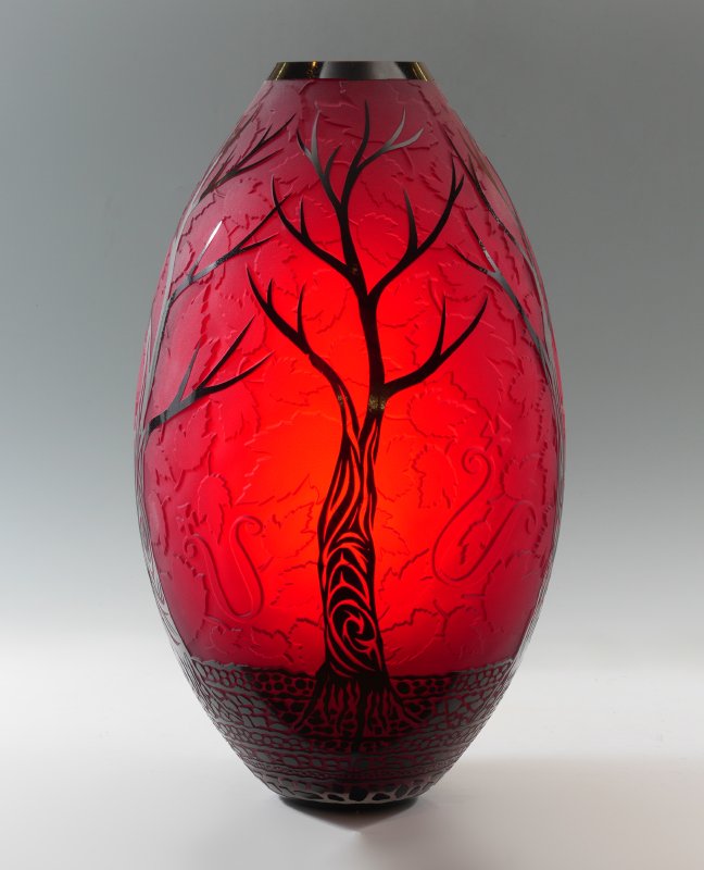 LARGE DUNCAN MCCLELLAN ART GLASS VASE: LARGE DUNCAN MCCELLAN ART GLASS VASE: Red ground with cameo foliate motifs, black figural trees and base with rocks. Signed on base, overall measures 25" h. x 13 1/2" dia.