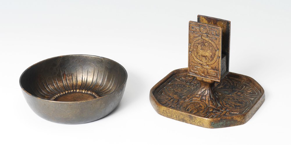 TIFFANY STUDIOS BRONZE MATCH HOLDER & BOWL: TIFFANY STUDIOS BRONZE MATCH HOLDER & BOWL: 2 pieces total to include 1) Zodiac pattern matchbox holder, marked ''Tiffany Studios, New York, 1041'', 3 1/2'' h. x 4 1/2''. 2) Sunburst pattern bowl or a
