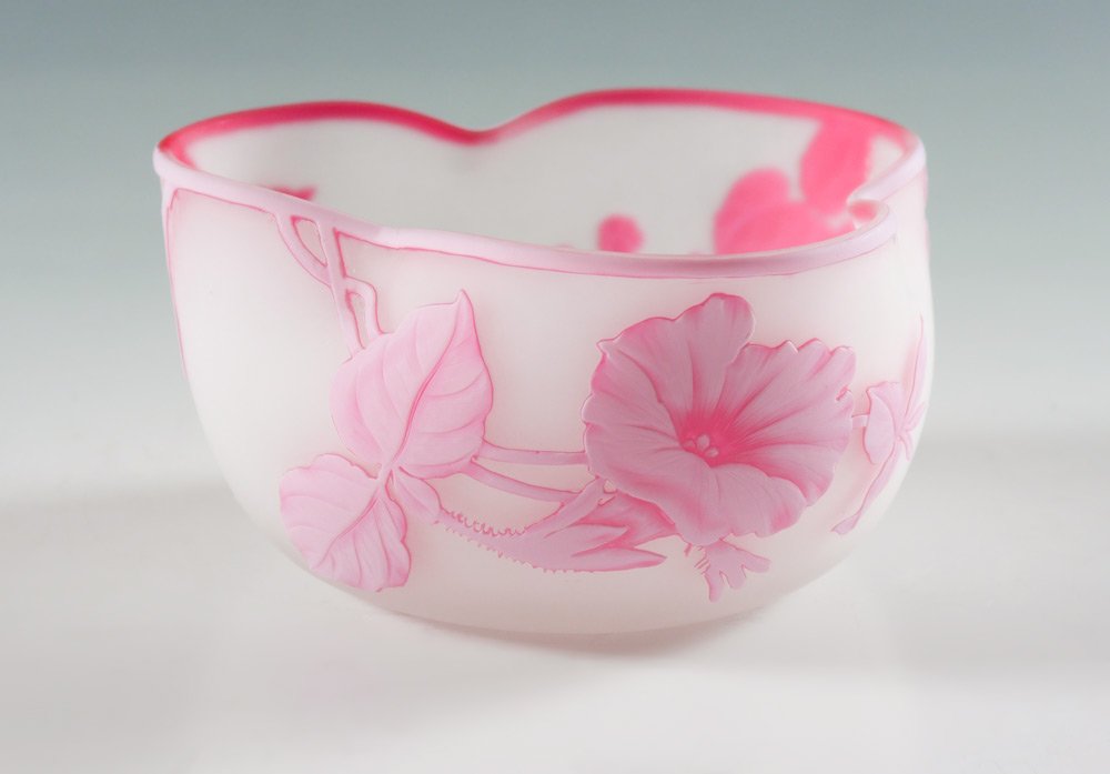 THOMAS WEBB CAMEO GLASS BOWL: THOMAS WEBB CAMEO GLASS BOWL: Frosted white ground, pink floral designs, pinched sides, unmarked attribution. Overall measures 2 3/4'' h. x 5 1/4''.