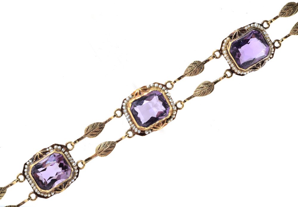 ANTIQUE AMETHYST & SEED PEARL BRACELET 14K GOLD: ANTIQUE EDWARDIAN AMETHYST AND SEED PEARL BRACELET: 14k yellow gold bracelet with 5 rectangular scissors or cushion cut amethyst totaling 17.5 Ct., rated VVS-VS clarity. The amethysts are bezel set an