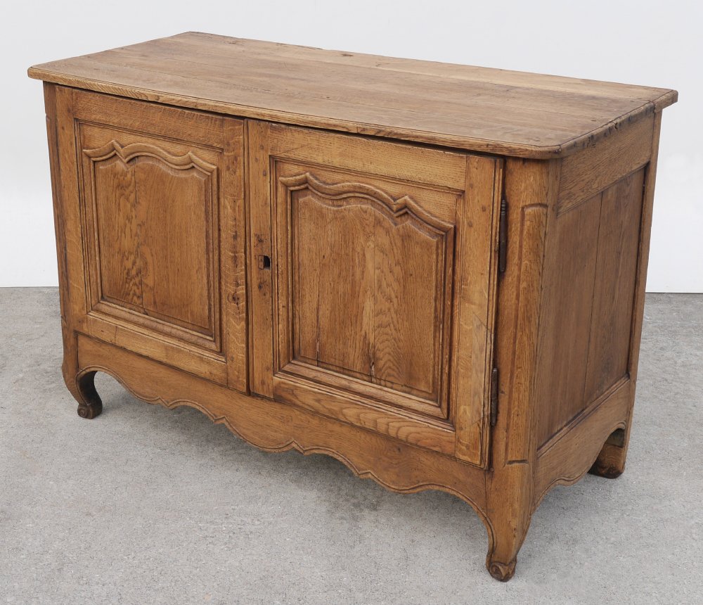 WALNUT COUNTRY FRENCH COMMODE: WALNUT COUNTRY FRENCH COMMODE: Early 19th century, 2 blind doors, iron hinges, shaped skirt and front legs, overall measures 34" h. x 50" x 22 1/2".