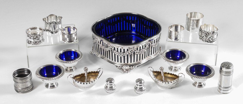 STERLING & SILVERPLATE TABLE ACCESSORIES: COLLECTION OF STERLING & SILVERPLATE TABLE ACCESSORIES: An assembled collection of items to include 4 Cartier sterling master salts with cobalt inserts, 1 1/2" h. x 2 3/4"; pair English silver master