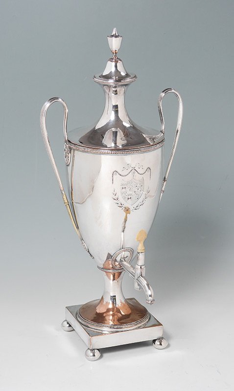 OLD SHEFFIELD SILVERPLATE HOT WATER URN: OLD SHEFFIELD SILVERPLATE HOT WATER URN: Urn form with double handles, body with engraved armorial crest, on 4 bun feet. No visible makers mark, overall measures 21 1/4" h. x 9 1/4". Sold with a vinta
