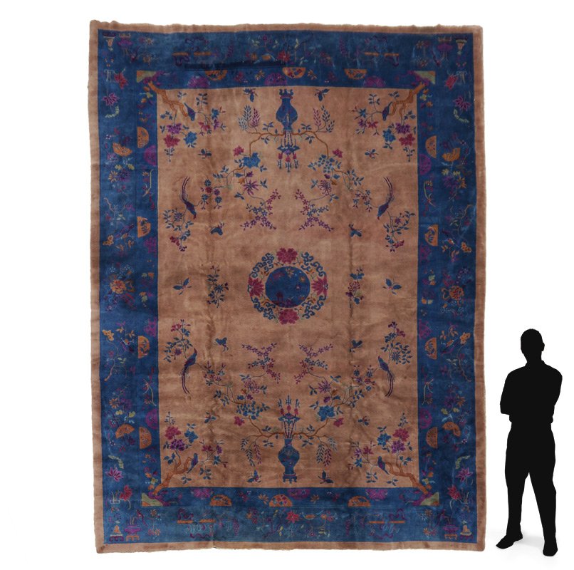 CHINESE HAND KNOTTED WOOL RUG 10'3" x 13'5": APPROX 75-95 YR OLD CHINESE HAND KNOTTED WOOL RUG, 10'3" x 13'5": This Deco era Chinese rug has a beige mink colored field with a small blue round central medallion and blue main borders. The birds an