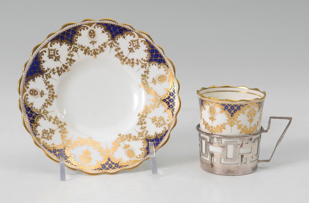 WALKER & HALL AYNSLEY SILVER MOUNTED DEMITASSE SET: WALKER & HALL AYNSLEY CASED SILVER MOUNTED DEMITASSE SET: Service for 6 with Walker & Hall 1932 Sheffield hallmarked holders, gilt and cobalt decorated inserts and saucers. Sold in original fitted cas