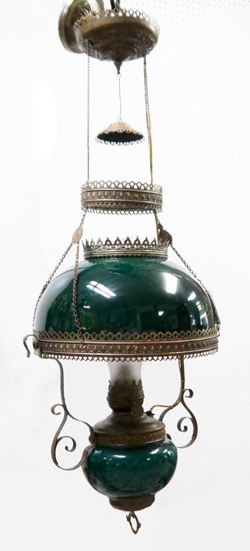 CASED GLASS SHADE AND FONT BRASS CEILING LIGHT: CASED GLASS SHADE AND FONT BRASS CEILING LIGHT: Electrified embossed brass frame, green cased glass oil reserve and shade, Success marked wick regulator, overall measures 38" h. x 17", shade 6 1/2" x 