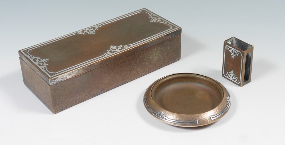3 PIECE SILVERCREST STERLING ON BRONZE SMOKING SET: 3 PIECE SILVERCREST STERLING ON BRONZE SMOKING SET: 3 pieces total marked "Silvercrest, Sterling Decorated Bronze", to include 1) Hinged cigarette box with compartmented wood interior, 2 1/4" h. x 9"