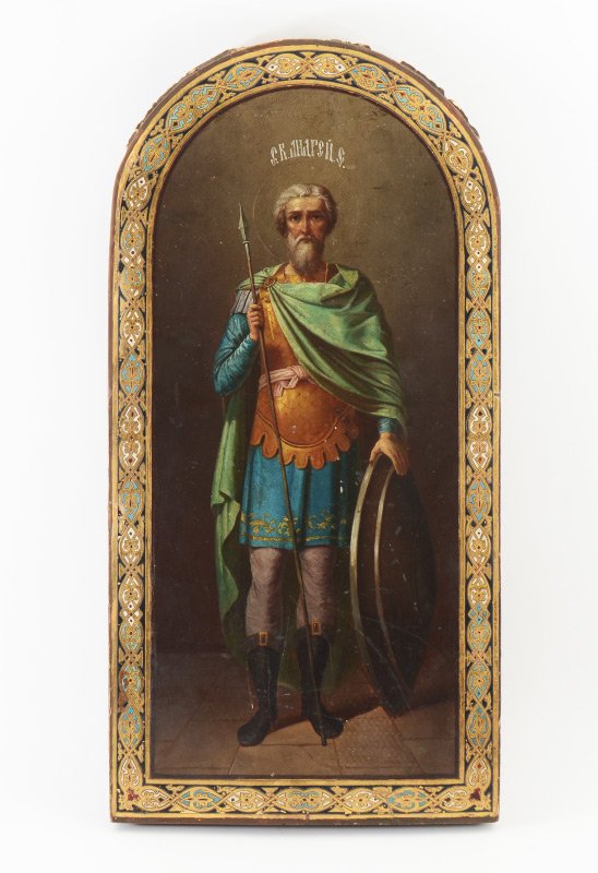 LARGE EARLY ICON PAINTING OF SAINT ANDREW: LARGE EARLY ICON PAINTING OF SAINT ANDREW: Painted on arched panel with decorative enamel border, 22.5" h x 11.25". Depicts the Saint Bearing a Shield, Armor and Spear. Detail is exceptional, painting