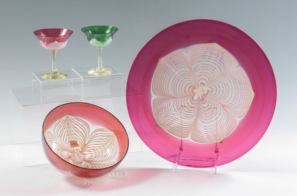 DURAND CRANBERRY & GREEN PULLED FEATHER GLASS: 4 PIECE DURAND CRANBERRY & GREEN PULLED FEATHER GLASS: 4 piece total, none signed, to include 1) Cranberry charger, 14 1/4'' dia. 2) Bowl, 3 3/8'' h. x 8 1/4''. 3-4) Green and cranberry cordial stems,