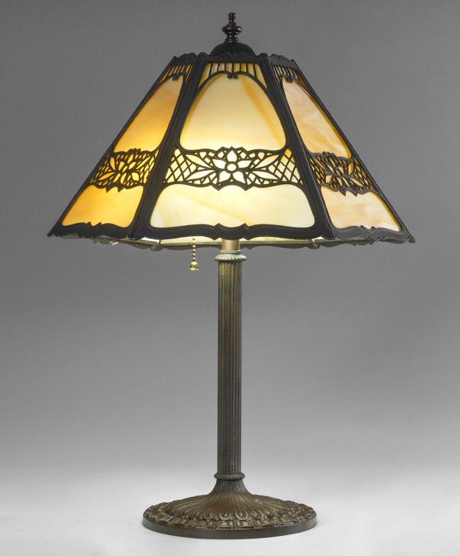 MILLER SLAG GLASS TABLE LAMP: MILLER SLAG GLASS TABLE LAMP: Patinated cast metal base marked EM&CO, 1164, double socket fixture, 21 1/4" h. x 7 1/4". 6 panel slag glass shade with filigree frame and shaped rim, 8" h. x 15".
