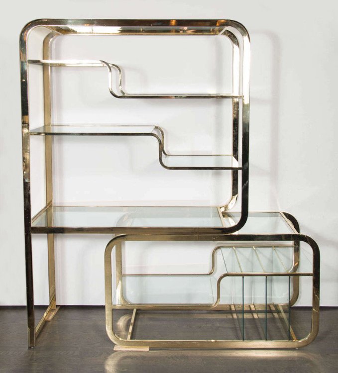 MILO BAUGHMAN BRASS ETAGERE FOR D.I.A.: MILO BAUGHMAN BRASS ETAGERE FOR D.I.A.: Multi level brass frame with glass shelves can expand sideways if desired, designed by Milo Baughman for the Design Institute of America. Overall in smallest se