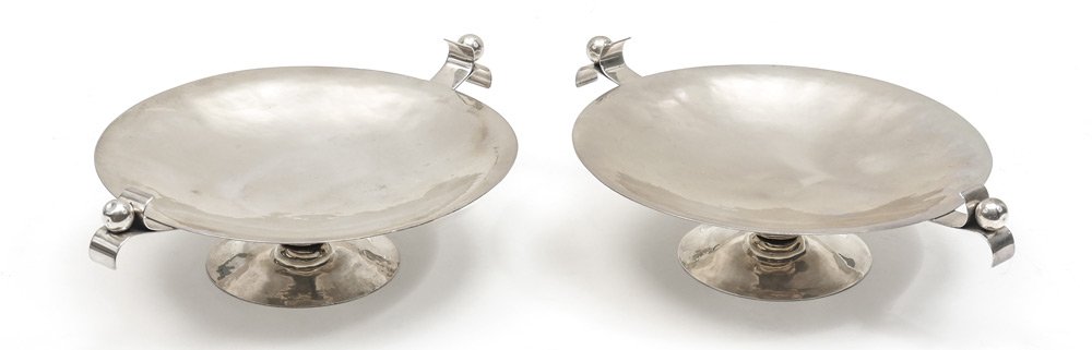 PAIR MICHAEL ARAM STERLING COMPOTES: PAIR MICHAEL ARAM STERLING COMPOTES: Hand hammered with Georg Jensen influenced handles, one marked on base "Sterling By Aram", the other marked Sterling. 3 1/4" h. x 11 1/4" dia., approx. 28.1 troy o