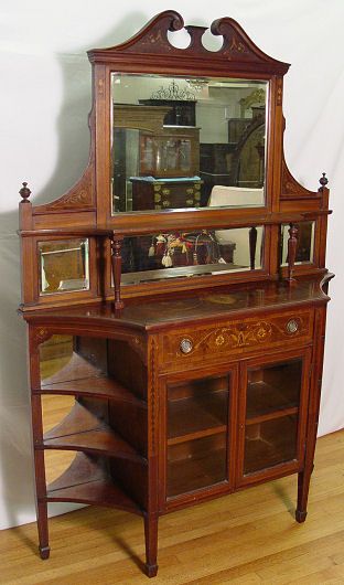 ENGLISH INLAID MAHOGANY SIDE CABINET: ENGLISH INLAID MAHOGANY SIDE CABINET: Marquetry and urn motif inlay on a narrow cabinet with bevel mirror top and mirror back side shelving. Full length drawer with reeded supports over over glass fro
