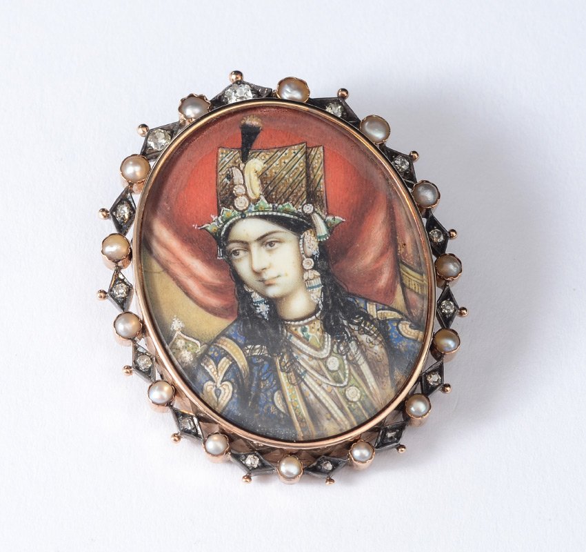 ANTIQUE PORTRAIT BROOCH 14K, STERLING DIAMONDS PEA: ANTIQUE MINIATURE PAINTING BROOCH: Diamonds and seed pearls set in 14K yellow gold with sterling silver frames the miniature portrait painting of Persian figure. The 14 old mine cut diamonds are bead
