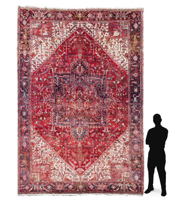 PERSIAN GORAVAN/HERIZ H K WOOL RUG 9'7'' x 13'11'': APPROX. 40-60 YR OLD PERSIAN GORAVAN/HERIZ HAND KNOTTED WOOL RUG, 9'7'' x 13'11'': This rug has a traditional design format found in rugs from the Heriz area. The large central medallion within a meda