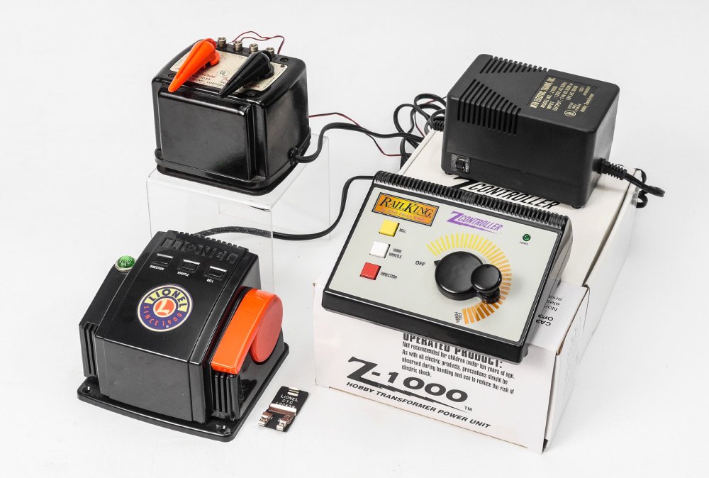 3 MODEL TRAIN TRANSFORMERS: 3 MODEL TRAIN TRANSFORMERS: 3 pieces total to include 1) Rail King Z-1000 Hobby Transformer, 100 watts, in original box, 4 1/2'' h. x 12'' x 9''. 2) Lionel 1033 Multi-Control, 90 watts, in original bo