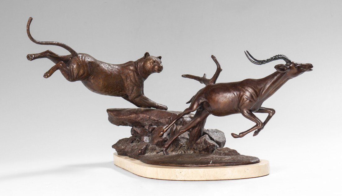 PAUL TADLOCK BRONZE SCULPTURE "SILENT HUNTER": TADLOCK, Paul, (American, 20th-21st Century): Cougar Stalking a Gazelle, Bronze, 11.5" ht, 19" w, signed, numbered 10/130, affixed to a marble plinth. Paul resigned as a corporate executive in the lat