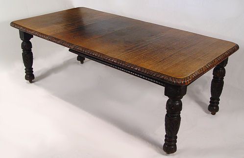 19th C CARVED OAK EXTENSION DINING TABLE: 19th C CARVED OAK EXTENSION DINING TABLE: Carved apron and turn carved legs. Included are the crank for extending the table and 2 leaves. 28"h. x 54" x 40 1/2". each leaf is 13 1/2" and extends the ta