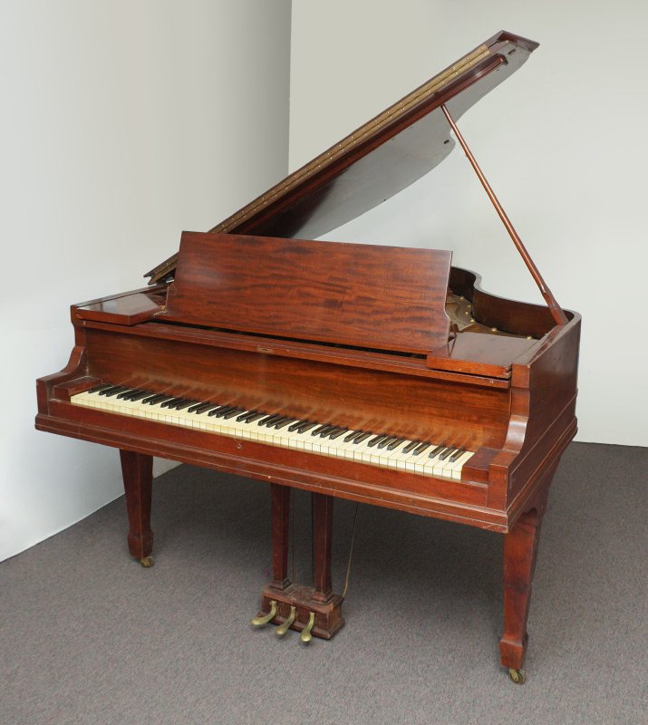 BRADBURY MAHOGANY PARLOR GRAND PIANO: BRADBURY MAHOGANY PARLOR GRAND PIANO: Striped mahogany case, marked on soundboard with Bradbury Ideal Grand / F. G. Smith Inc., celluloid keys. Overall measures 39 1/4'' h. x 65'' x 57 3/4''.