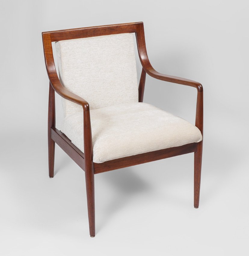 DANISH MODERN STYLE TEAK ARM CHAIR: DANISH MODERN STYLE TEAK ARM CHAIR: Bent wood shaped arms, turned supports and legs, cream upholstered seat and back. No visible markings, overall measures 32 1/4'' h. x 24 1/2'' x 25''.