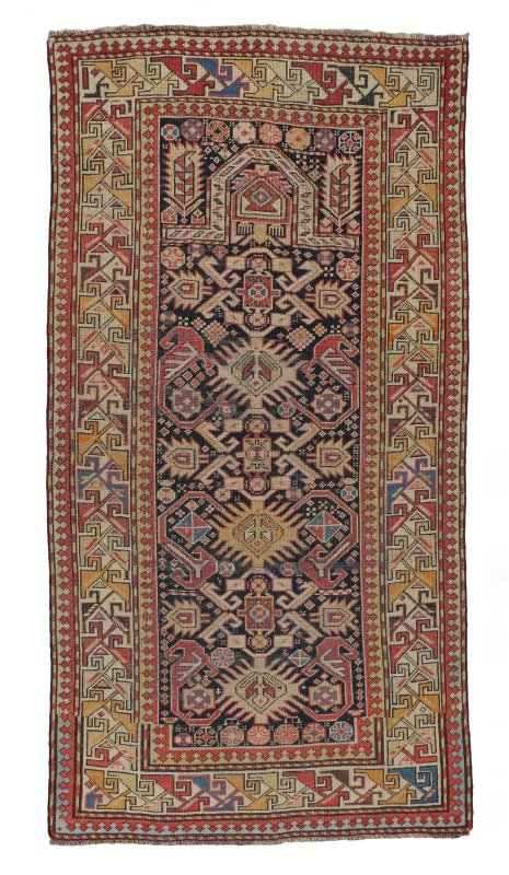 ANTIQUE CAUCASIAN SHIRVAN H K WOOL PRAYER RUG 3'2": ANTIQUE CAUCASIAN SHIRVAN HAND KNOTTED WOOL PRAYER RUG, 3'2" x 5'4": This rug has a lively geometric design that includes a central row of two patterns of medallions each with long lines that radiate 