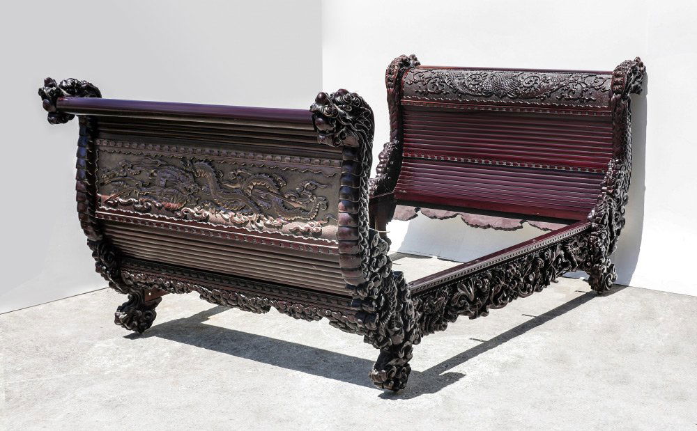 JAPANESE CARVED FIGURAL DRAGON BED: JAPANESE CARVED FIGURAL DRAGON BED: Matching headboard and foot board with figural dragon supports, outside carved panel with relief figural dragon, interior with foliate scroll. Headboard 49 1/2" h.